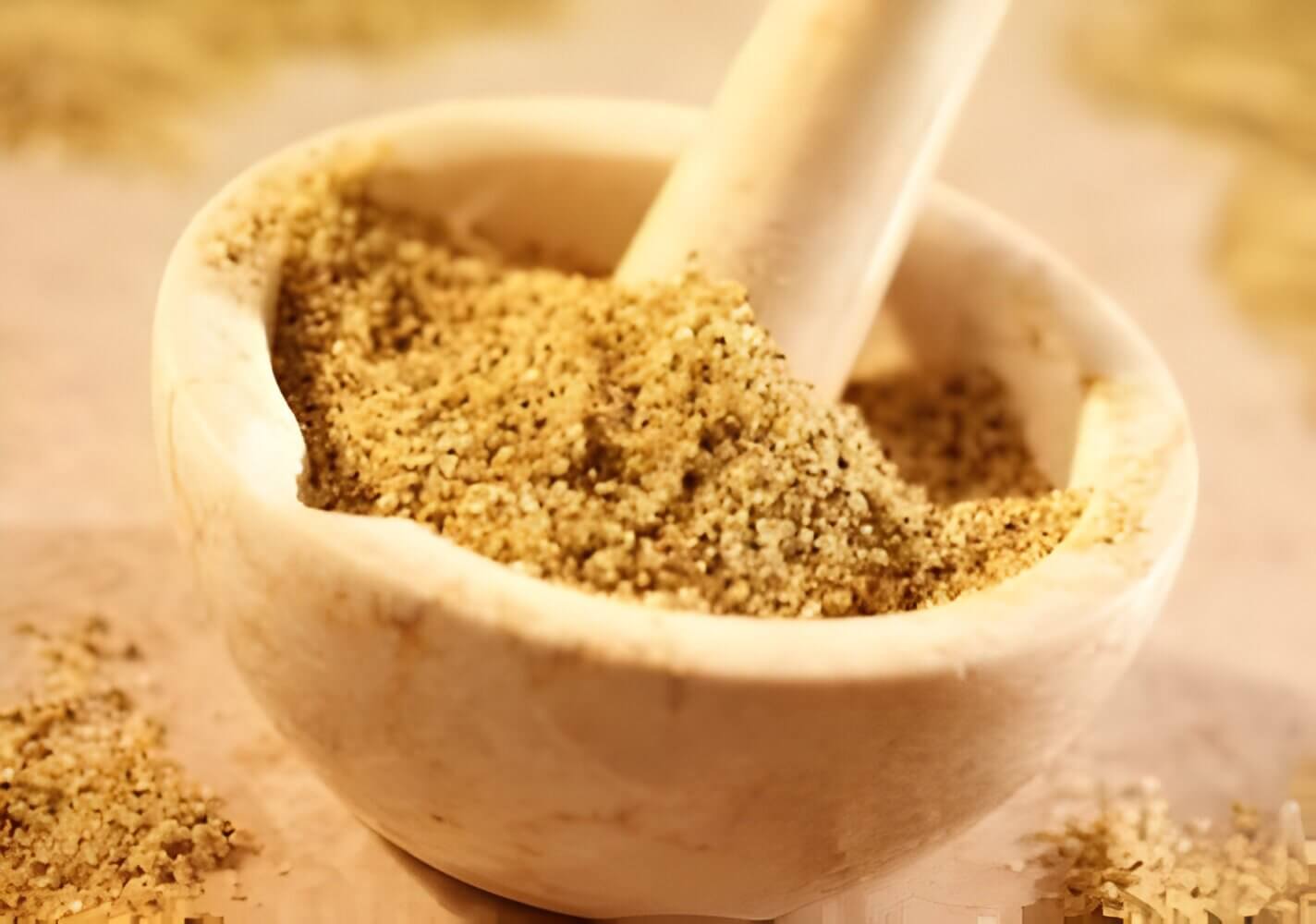 Lemon pepper seasoning in a mortar and pestle.