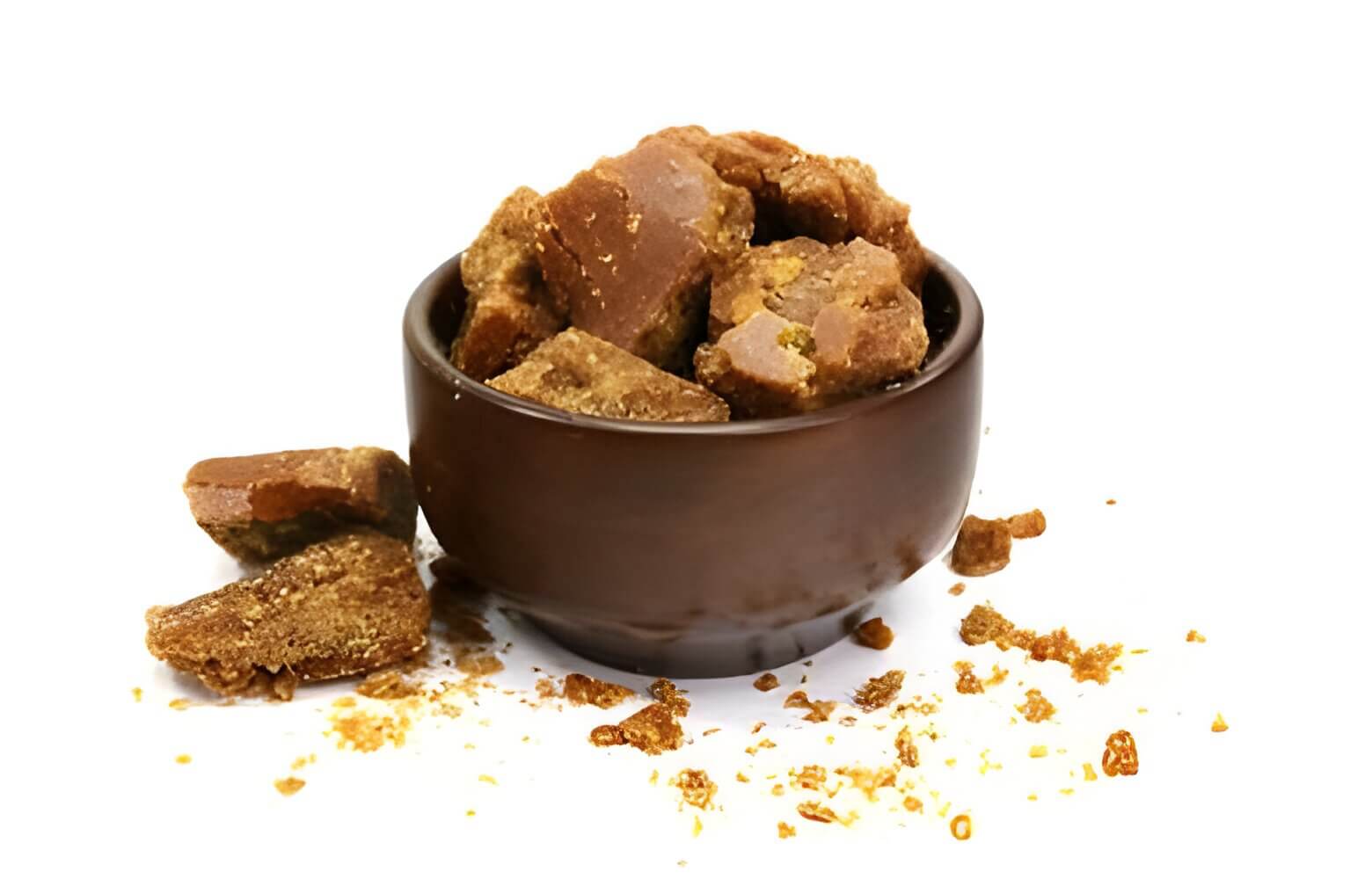 A block of jaggery in a bowl.