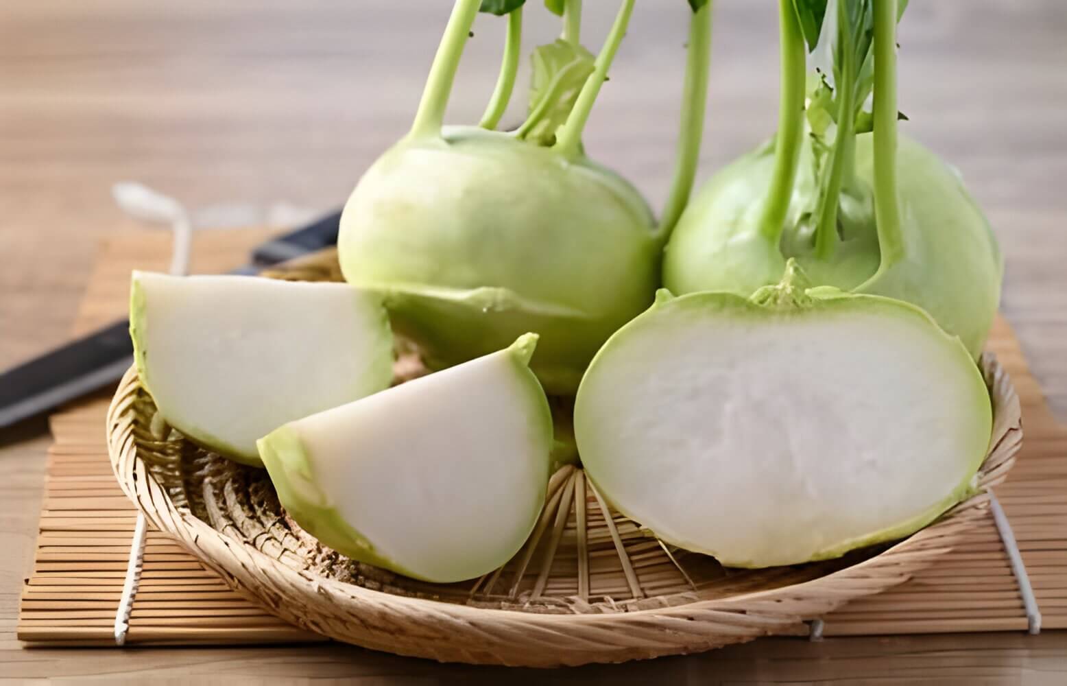 Close-up of a kohlrabi bulb, showing its green, turnip-like form.